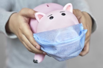 piggy bank wearing medical mask